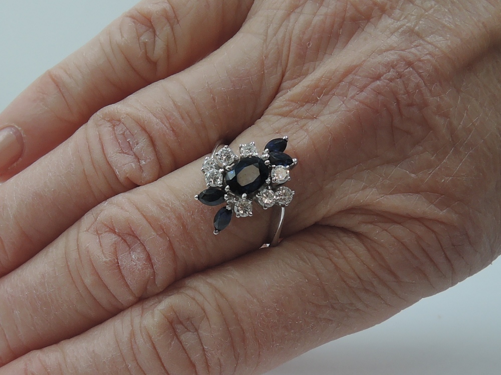 A lady's dress ring having a central sapphire, approx 0.75ct surrounded by four marquise cut - Image 2 of 2