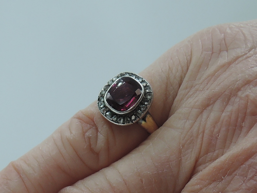 A lady's dress ring having a central pink stone possibly tourmaline in a collared mount with diamond - Image 2 of 5