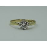 A lady's diamond solitaire dress ring, approx 0.75ct in a claw set mount to raised shoulders on an