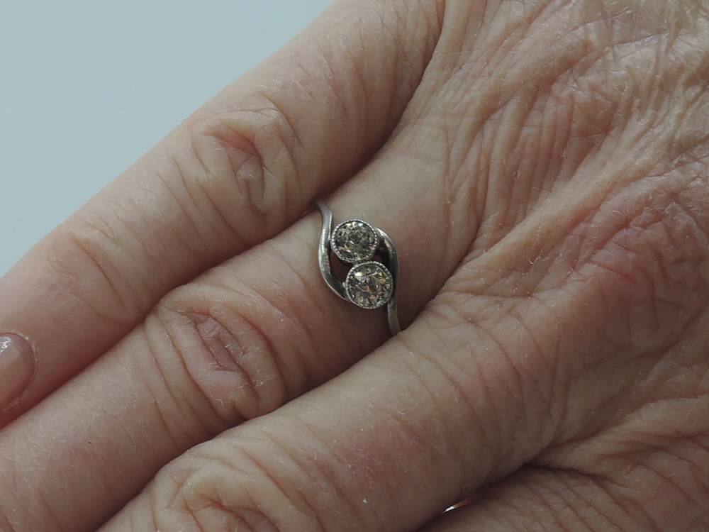 A lady's dress ring having a duo of spinels in collared mounts to cross over shoulders on a yellow - Image 2 of 2