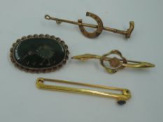 Three 9ct gold bar brooches of various designs and a green stone intaglio brooch depicting a kiwi,