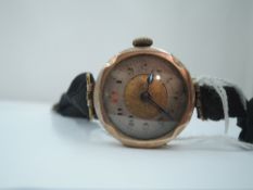 A lady's vintage 9ct rose gold wrist watch having an Arabic numeral dial and canvas strap