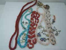 A selection of strings of beads including coral, turquoise style, baroque style pearls etc and a