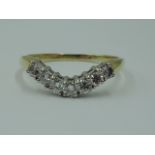 A lady's shaped half eternity ring having seven diamonds, total approx 0.35ct in a curved claw set