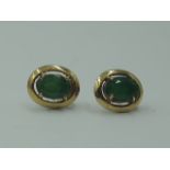 A pair of 9ct gold stud earrings having jade style oval stones