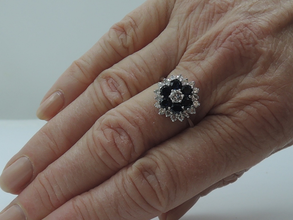 A lady's dress ring having a diamond and sapphire triple cluster, total weights approx 0.80ct - Image 2 of 2