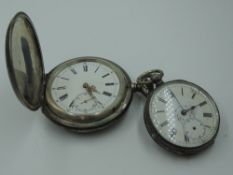 A Swiss white metal top wound pocket watch bearing Hahn mark to mechanism, having Roman numeral dial