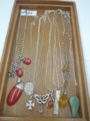 A selection of white metal and silver pendants and chains including amber, St Christopher, Rennie