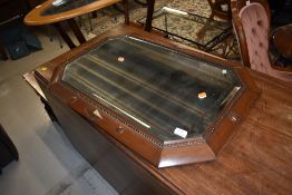 An hall way or mantle mirror with heavy set oak frame and bevel edged glass