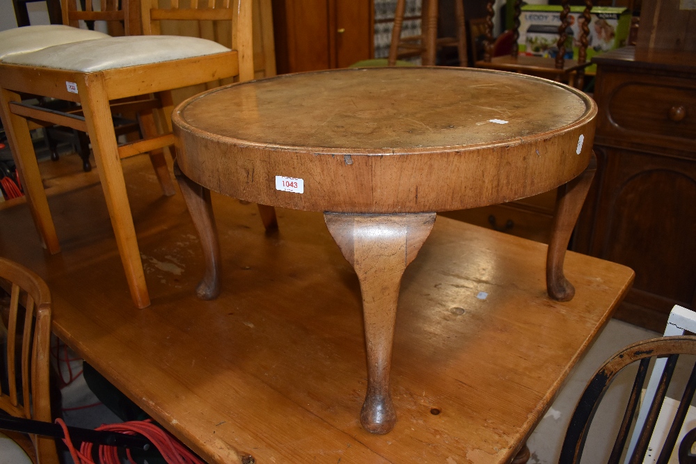 A veneered circular low coffee or tea table