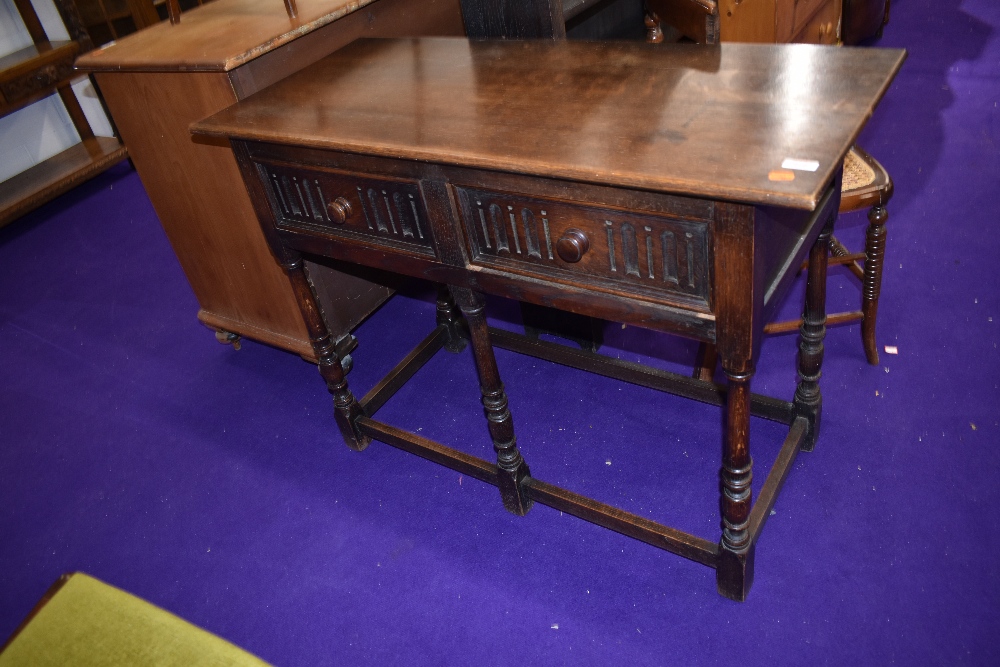 A Priory style oak hall table or dresser base having two frieze drawers , width approx. 107cm