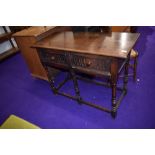 A Priory style oak hall table or dresser base having two frieze drawers , width approx. 107cm