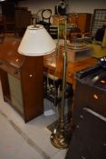 A modern brushed brass adjustable standard lamp good solid design