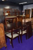 A reproduction Regency dining table and six (four plus two) chairs