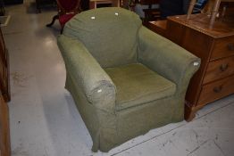 An arm chair having green covering