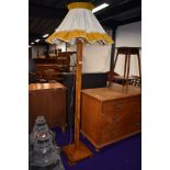 An Art Deco oak parquetry standard lamp, with vintage shade