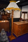 An Art Deco oak parquetry standard lamp, with vintage shade