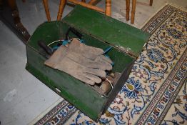 A metal tool chest having various tools and hammers