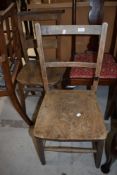 Two traditional farm or country house style chairs having elm or similar yew wood seats