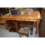 A heavy set pine kitchen table with drawer H76cm x W85cm x L150cm