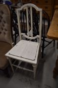 A painted bedroom chair having turned frame work