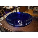 A Bristol style blue glass fruit bowl with ribbed design