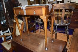 An early 20th Century hall table, having Art Deco style drop handles to frieze drawer, on cabriole