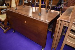 An early 20th Century drop leaf table on cabriole legs, width approx. 114cm
