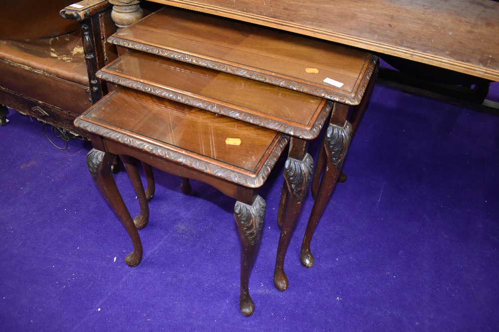 A period style nest of tables, glass insets