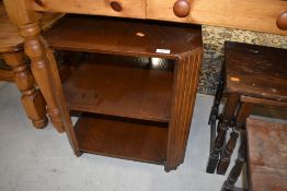 An early to mid 20th Century oak occasional table/bookcase