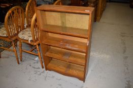 A small oak bookshelf having glazed top W60cm x H90cm x D20cm