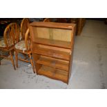 A small oak bookshelf having glazed top W60cm x H90cm x D20cm