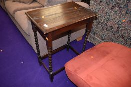 An early 20th Century oak side table on twist legs, approx. 56 x 38cm