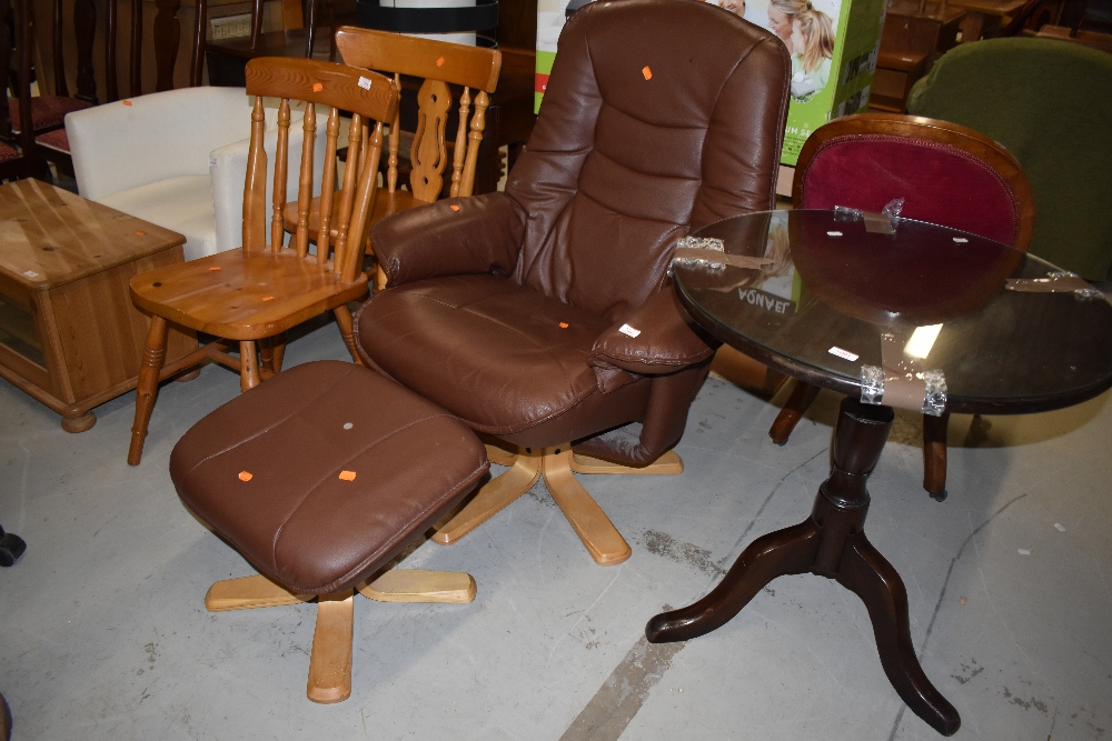 A modern brown easy recliner and foot stool in the stressless style