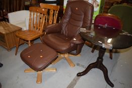 A modern brown easy recliner and foot stool in the stressless style