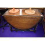 An early to mid 20th Century oak twist gate leg table, width approx. 107cm