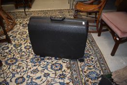 A hard bodied Samsonite suitcase