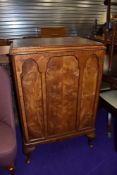 An early 20th Century panel cabinet, converted to wine cabinet
