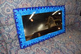 A modern blue mosaic mirror, approx. 75 x 44cm