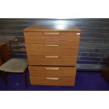 A vintage laminate (teak effect) bedroom chest of five long drawers, width approx. 77cm