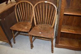 Two elm and ash hoop and stick back chairs having turned frame work both have signs of historic worm