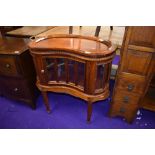 A reproduction display cabinet of kidney shape having tray top, width approx. 73cm