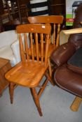 Two modern light stained kitchen chairs one pine and one beech wood