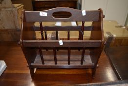 A tradtional spindle style magazine rack