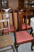 A set of three mahogany dining chairs with cabriole legs and vase back