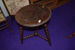 A traditional carved occasional table on turned frame, diameter approx. 46cm