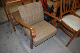 An arts and crafts style childs or similar small low curved arm chair