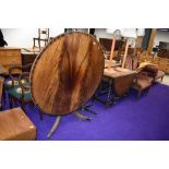 A reproduction Regency fold over circular dining table, diameter approx. 122cm