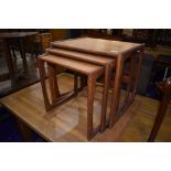 A vintage teak G plan nest of three tables