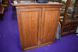 A traditional oak double cupboard, approx. dimensions W110 H122 D50cm